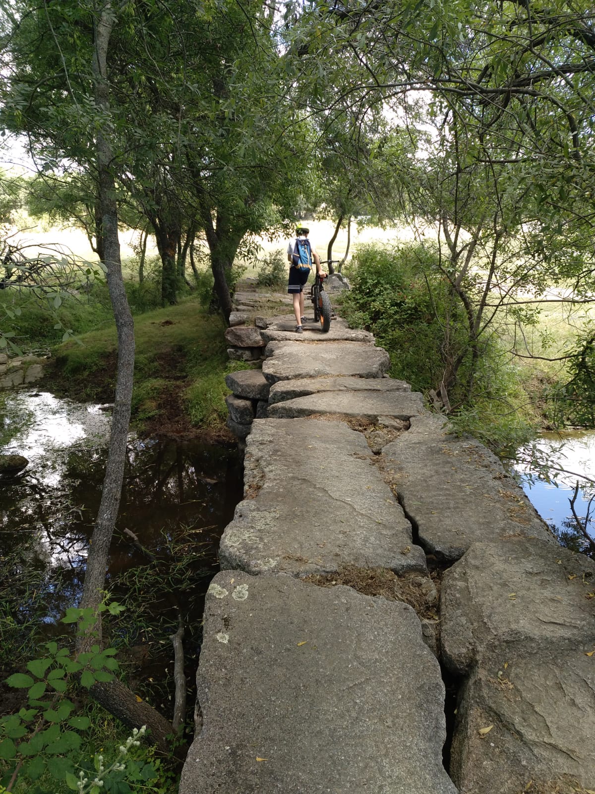 Stone bridge on the Camino de San Martín with an electric mountain bike